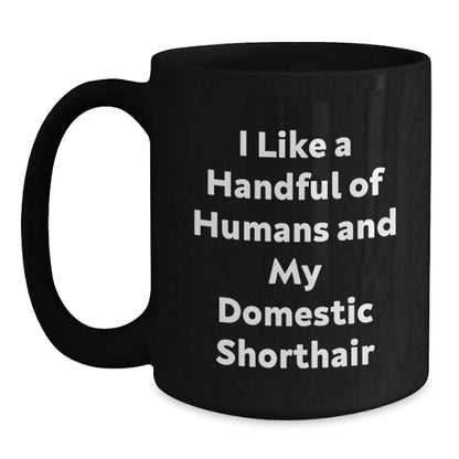 Funny Domestic Shorthair Cat Gifts for Men, Women, Friends - I Like A Handful Of Humans And My Domestic Shorthair Black Coffee Mug for Christmas - Main