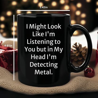 Funny Metal Detecting Gifts - 'I Might Look Like I'm Listening To You But In My Head I'm Detecting Metal.' Black Coffee Mug from Friends and Family