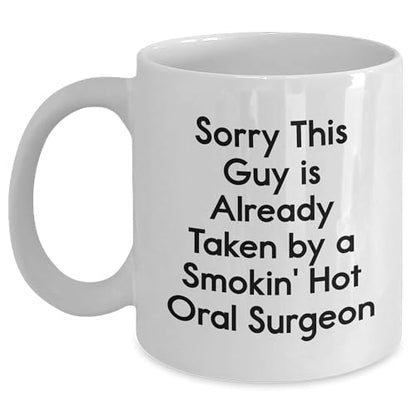 Funny Oral Surgeon Gifts from Friends - Sorry, This Guy is Already Taken by a Smokin' Hot Oral Surgeon White Ceramic Coffee Mug - Mallard Moon Gift Shop