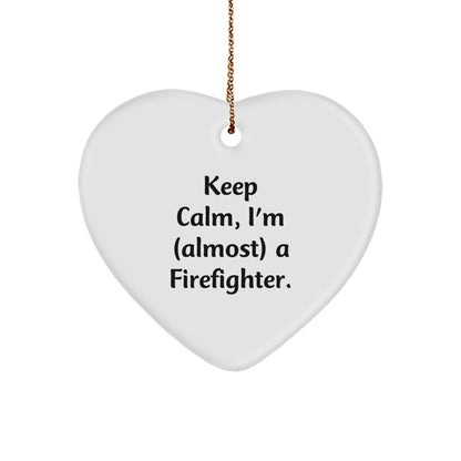 Funny Firefighter Gifts from Friends, Heart Ornament for Christmas Unique Gifts, Inspirational 'Keep Calm, I'm (almost) A Firefighter' Quote for Firefighter Men - Image 1