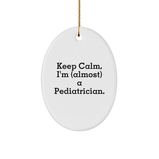 Funny Gifts from Mom, Dad, or Friends to Pediatricians on Christmas Unique Gifts - Oval Ornament Keep Calm, I'm (almost) A Pediatrician. - Image 1
