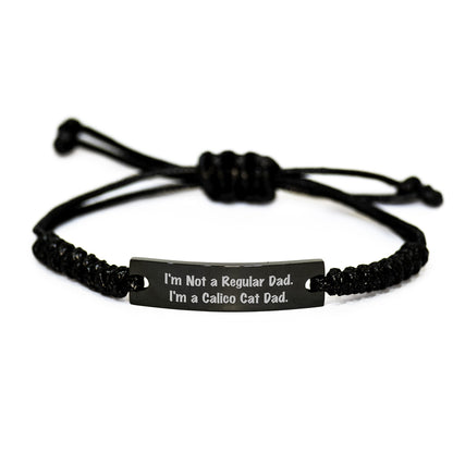 Calico Cat Dad Funny Graduation Gifts from Men to Friends with Rope Bracelet, 'I'm Not A Regular Dad. I'm A Calico Cat Dad.' Quote, Adjustable Black Stainless Steel with Interlaced Rope - Image 1
