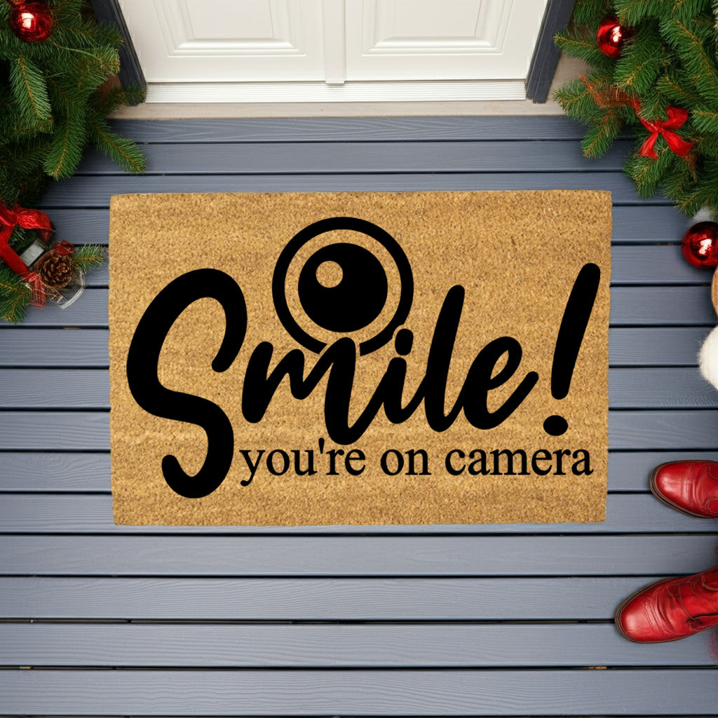 “Smile! You’re on Camera” Funny Security Doormat | Coir Welcome Mat for Home Surveillance | Humorous Front Porch Décor - Mallard Moon
