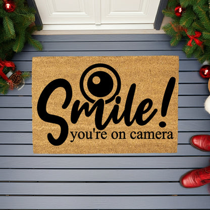 “Smile! You’re on Camera” Funny Security Doormat | Coir Welcome Mat for Home Surveillance | Humorous Front Porch Décor - Mallard Moon